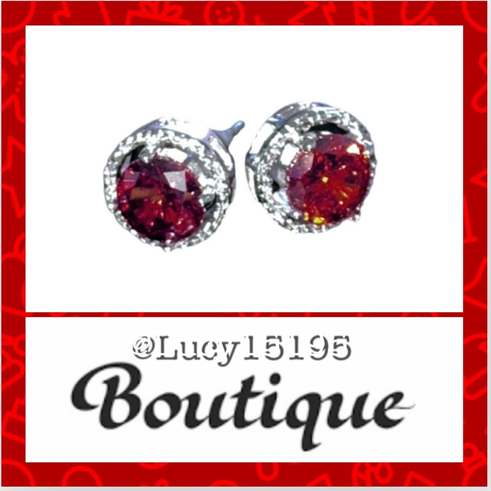 Rhodium Plated Red Circonia Solitaire Surrounded By Clear Circonia Pave Studs